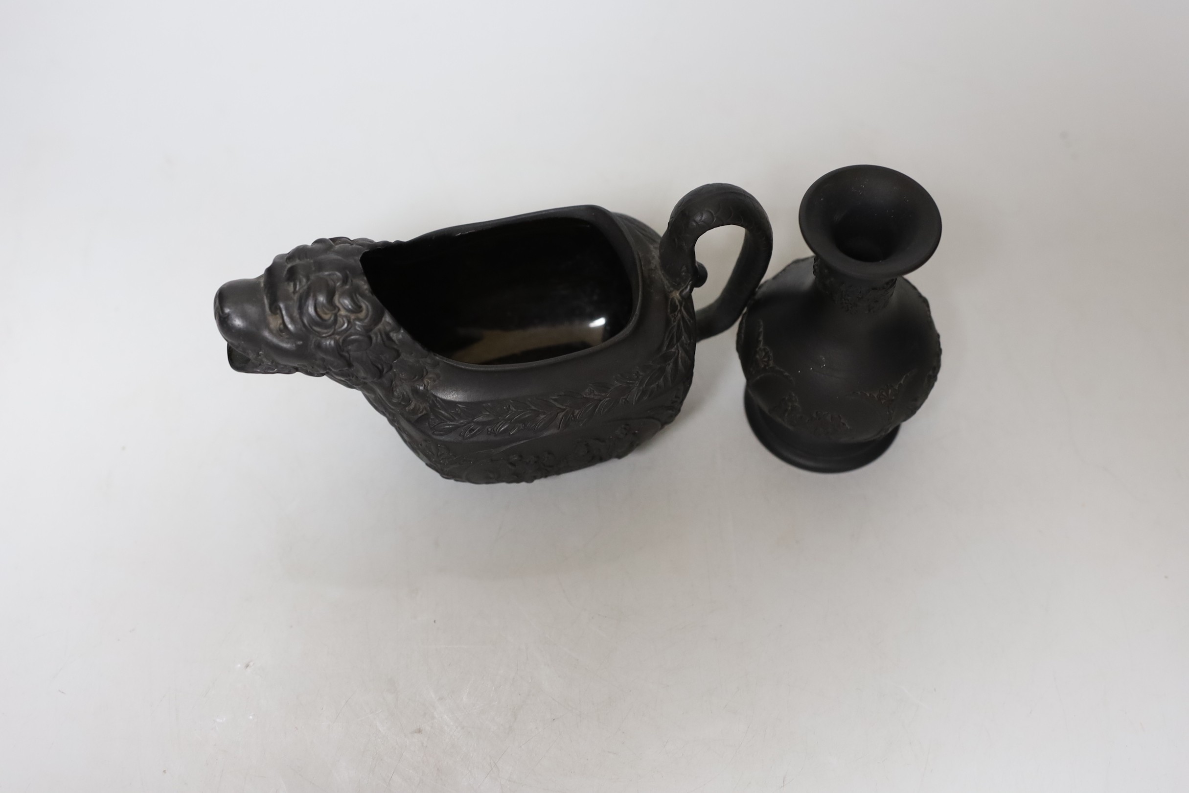 An early 19th century Wellington commemorative black basalt cream jug and a Wedgwood basalt vase